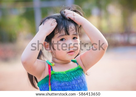 Girl scratching head , Portrait , Asian girl scratching head
