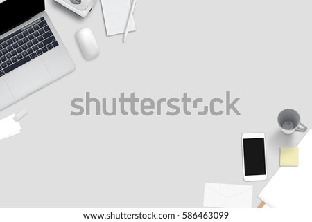 Computer, smart phone and stationery on gray desk. Top view with free space for text.