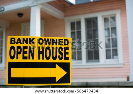 Bank Owned Open House. In Front of a Home