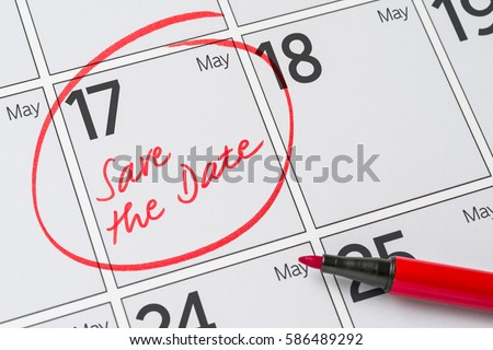 Save the Date written on a calendar - May 17 Royalty-Free Stock Photo #586489292