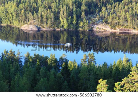Beautiful landscape from the top of the hill. The lake and Karelian forest in Repovesi national Park. Finland.