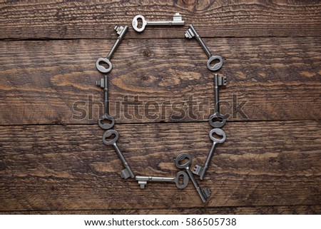 old vintage keys on a wooden background  the form of letters of the entire alphabet
