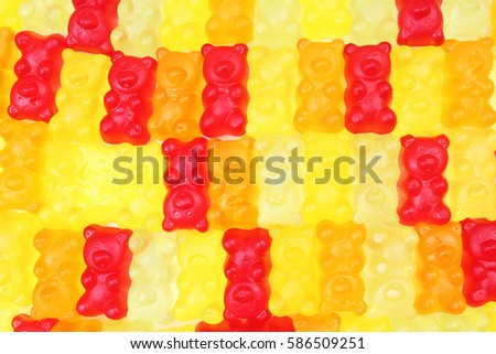 
Gummy bear background. Gummy bears as texture. Gum bear candy colorful pattern.