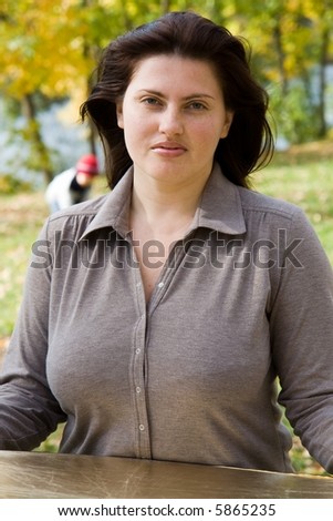 Beautiful girl with a reflector in autumn park