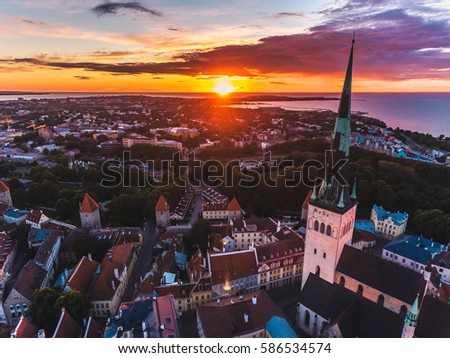 Amazing aerial drone shot of old town of Tallinn, Estonia at sunset
