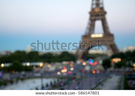 Blurred background silhouette eiffel tower in Paris with defocus bokeh and sunset light