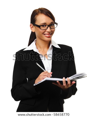 Young successful career woman writes in her personal organizer