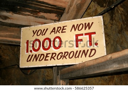 Information sign about depth measurement in underground mine