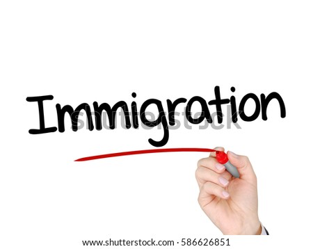 A hand with a marker writing 'Immigration'.