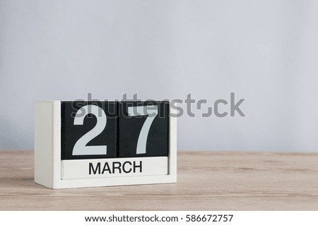 March 27th. Day 27 of month, wooden calendar on light background. Spring time, empty space for text. World Theatre Days