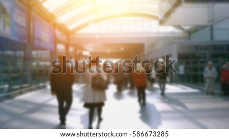  People at a train station theme, creative defocus and abstract motion blur  background with bokeh effect. Suitable for designs as background                              