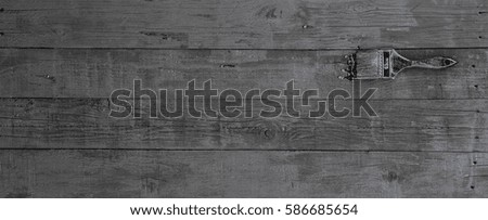 black paint brush, fresh colored lining, black abstract wood background, restoration, web banner