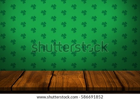 Digital composite of Patricks day wallpaper above table