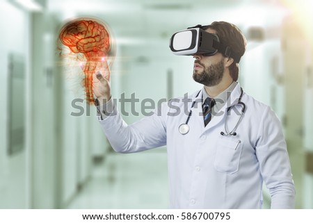 Male doctor at a hospital, using a Virtual Reality Glasses, looking at a virtual brain.