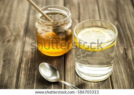 morning glass of water with lemon juice and honey. healthy lifestyle, and health care and proper nutrition for weight loss Royalty-Free Stock Photo #586705313