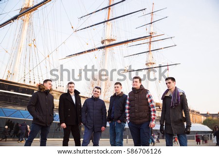 Closeup of group male people standing near ship