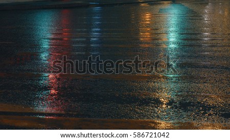Wet old crosswalk in the night lighting Royalty-Free Stock Photo #586721042