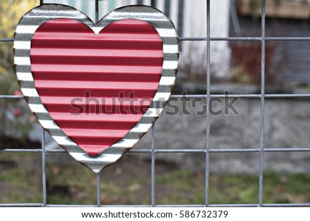 Red Aluminum Shaped Heart on Wire Fence