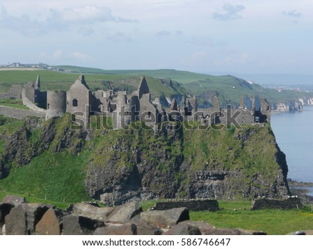 Northern Ireland / Northern Ireland's castle / picture showing one of the most famouse castles in Northern Ireland's coast (Dunluce castle), taken in June 2014.