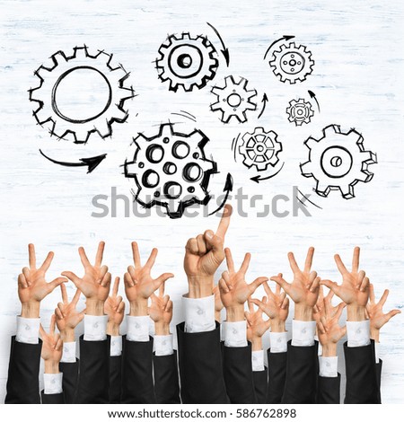 Group of hands of businesspeople showing gestures on wooden background