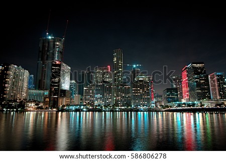 Miami, Florida, view on the skyline of downtown Miami at night with reflection in the water.