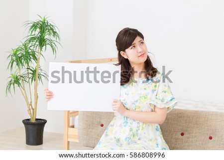young attractive asian woman having a white board, think,