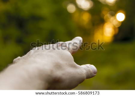 pointing to sun Royalty-Free Stock Photo #586809173