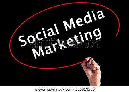 Hand Writing Social Media Marketing with a marker over transparent board