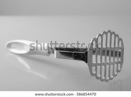 Close up of potato masher isolated on white background