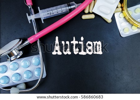 Autism word, medical term word with medical concepts in blackboard and medical equipment background.