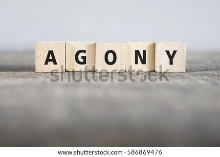AGONY word made with building blocks