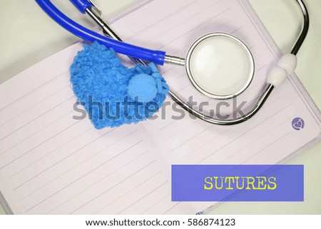 Stethoscope and heart shape on an open book on a white background. Medical, Healthcare and Wellness concept.