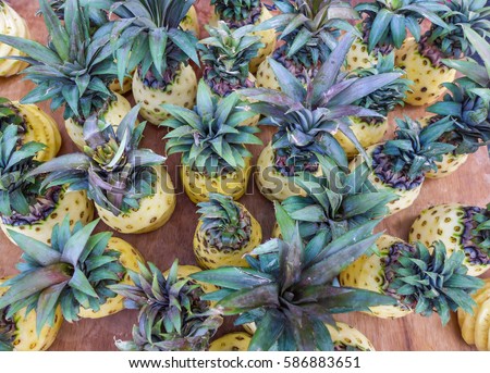 Bumper crop fresh farm produce / Pineapple background / Sold by the lorry-load near the morning market place