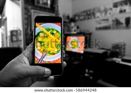 food photo in smart phone on hand.Black and white.