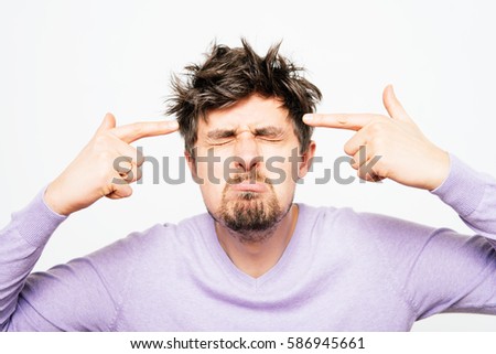 Closeup portrait of angry man gesturing with his finger against his temple, are you crazy?
