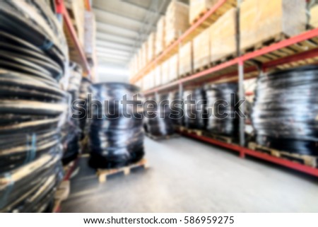 Warehouse industrial and logistics companies.Coiled plastic pipe. Deep blur effect.