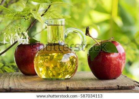 Apple Cider Vinegar is vinegar made from fermented apples fresh.
 Royalty-Free Stock Photo #587034113