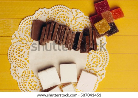 chocolate candy on a wooden background.