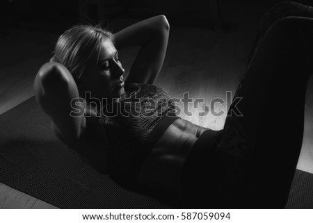 A woman doing push ups on a gym mat - Stock image
Exercising, Sport, Women, Only Women, Sports Training