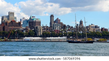 Brooklyn skyline and sailing ship on east river as seen from Wall Street, Manhattan, New York
