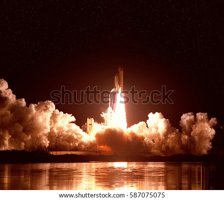 Cloudy launch of rocket into  outer space. "The elements of this image furnished by NASA"
 Royalty-Free Stock Photo #587075075
