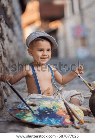 Little painter on the street
