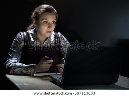 Surprised woman playing video games