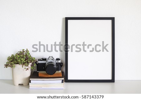 mock up frame photo  on desk Royalty-Free Stock Photo #587143379