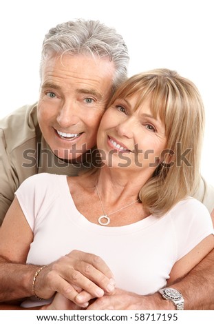 Happy seniors couple in love. Healthy teeth. Isolated over white background