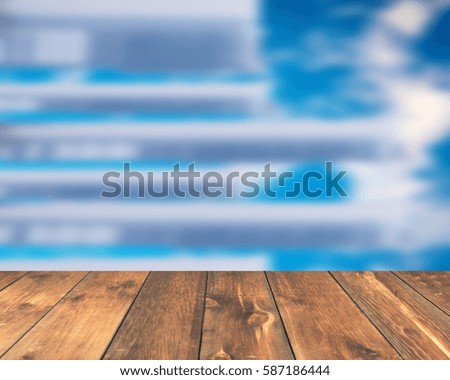 Empty wooden table top with abstract background