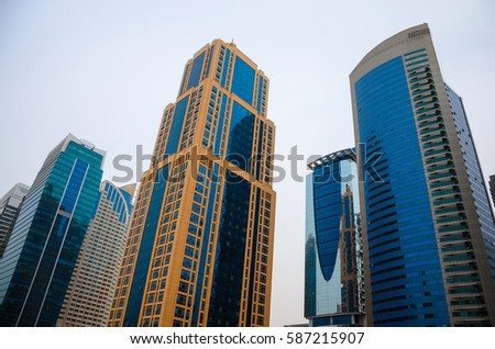 Skyscrapers of Dubai, modern architecture Royalty-Free Stock Photo #587215907