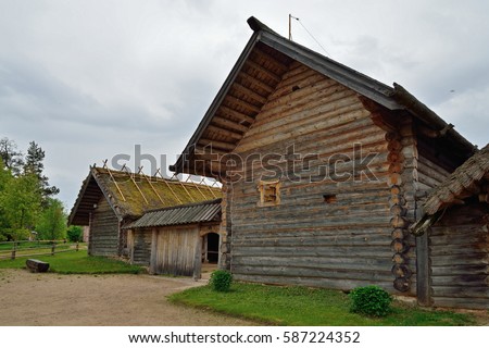 Old Russian log hut in Pushkin Mikhailovskoe summer cloudy day