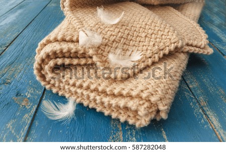 Soft warm blanket on a wooden surface