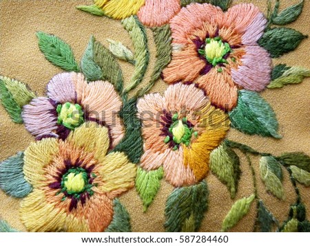embroidered yellow flowers on natural fabric, Ukrainian folk embroidery, decorated clothes